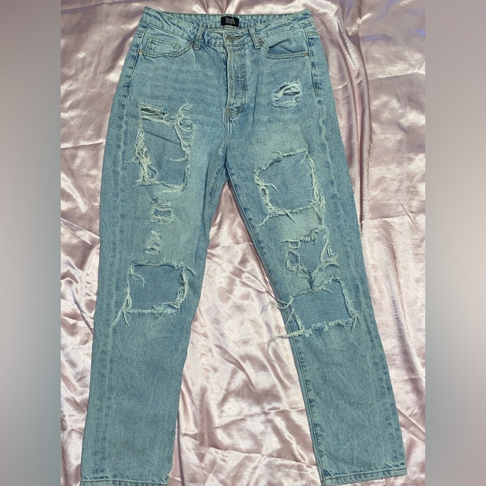 Baggy worn out jeans light blue size 9 but fits a 8